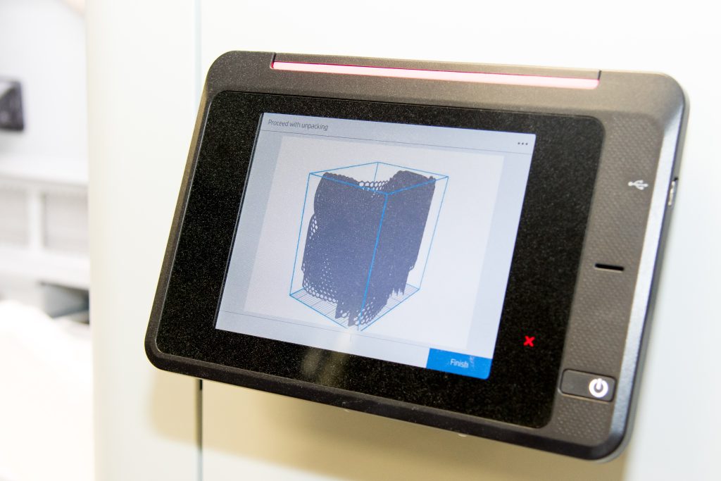An electronic tablet screen showing a render of a 3D component.