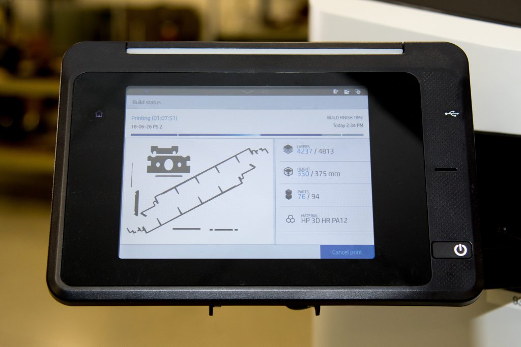 A build-status dashboard on a printer touchscreen showing live part progress